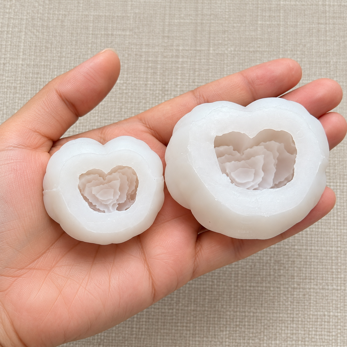 Create heart-shaped rose candles in two sizes with this 2-piece silicone mold set. Includes large and small molds for gifts, weddings and DIY projects.