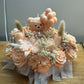 Handmade peach floral candle bouquet with teddy bear detail in ceramic base
