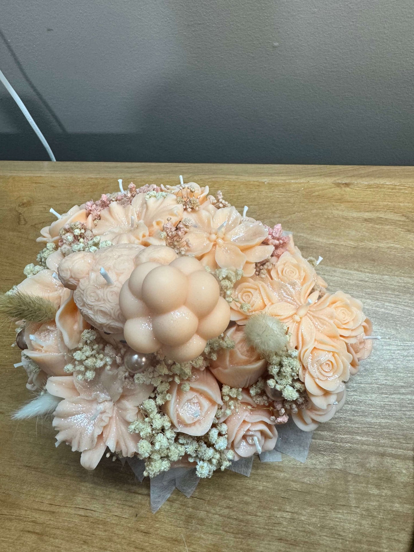 Handmade peach floral candle bouquet with teddy bear detail in ceramic base