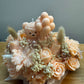 Handmade peach floral candle bouquet with teddy bear detail in ceramic base