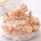 Handmade peach floral candle bouquet with teddy bear detail in ceramic base