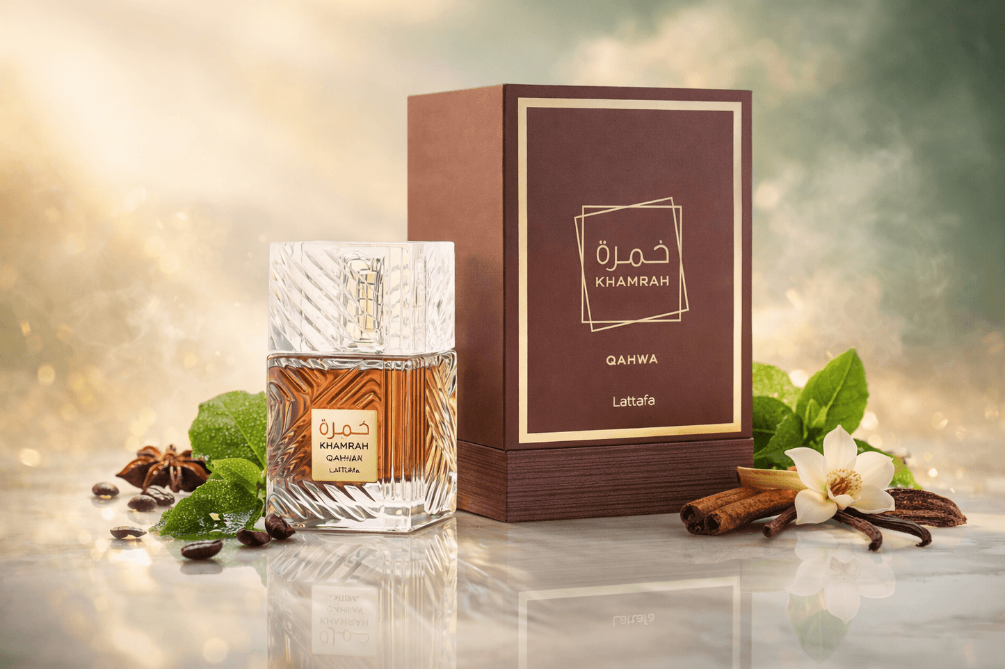 Khamrah Qahwa bottle with a cup of coffee and mint leaves on a marble surface.