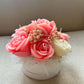Solandra Eternal Bloom handmade floral candle centerpiece featuring handcrafted wax roses and decorative flower accents.