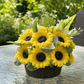 Handmade scented yellow sunflower candle bouquet with green foliage and plastic base