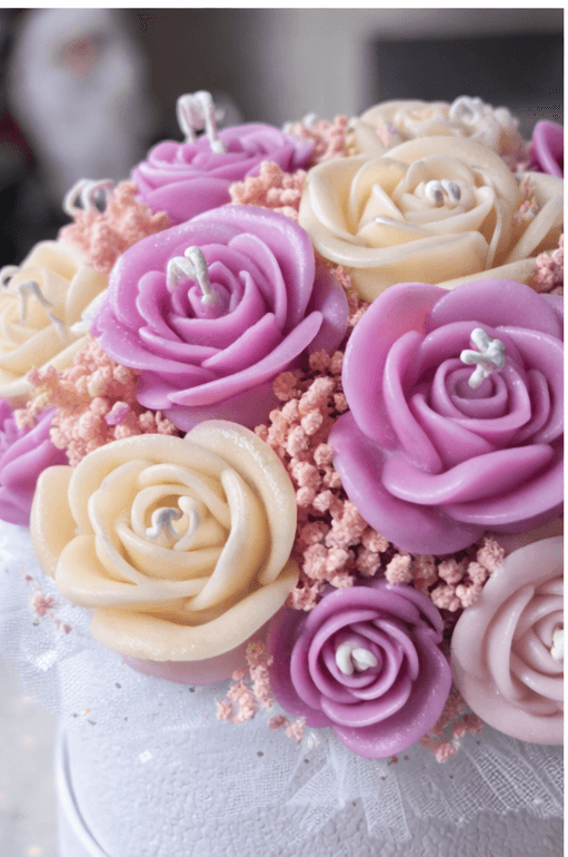 Handmade rose bouquet candle in pink and cream colors decorative floral candle