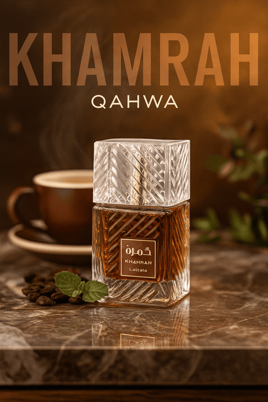 Khamrah Qahwa bottle with a cup of coffee and mint leaves on a marble surface.