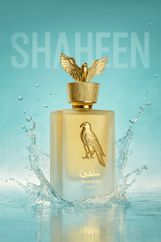 Perfume bottle with gold eagle design on a light blue background, featuring the brand 'Shaheen'.