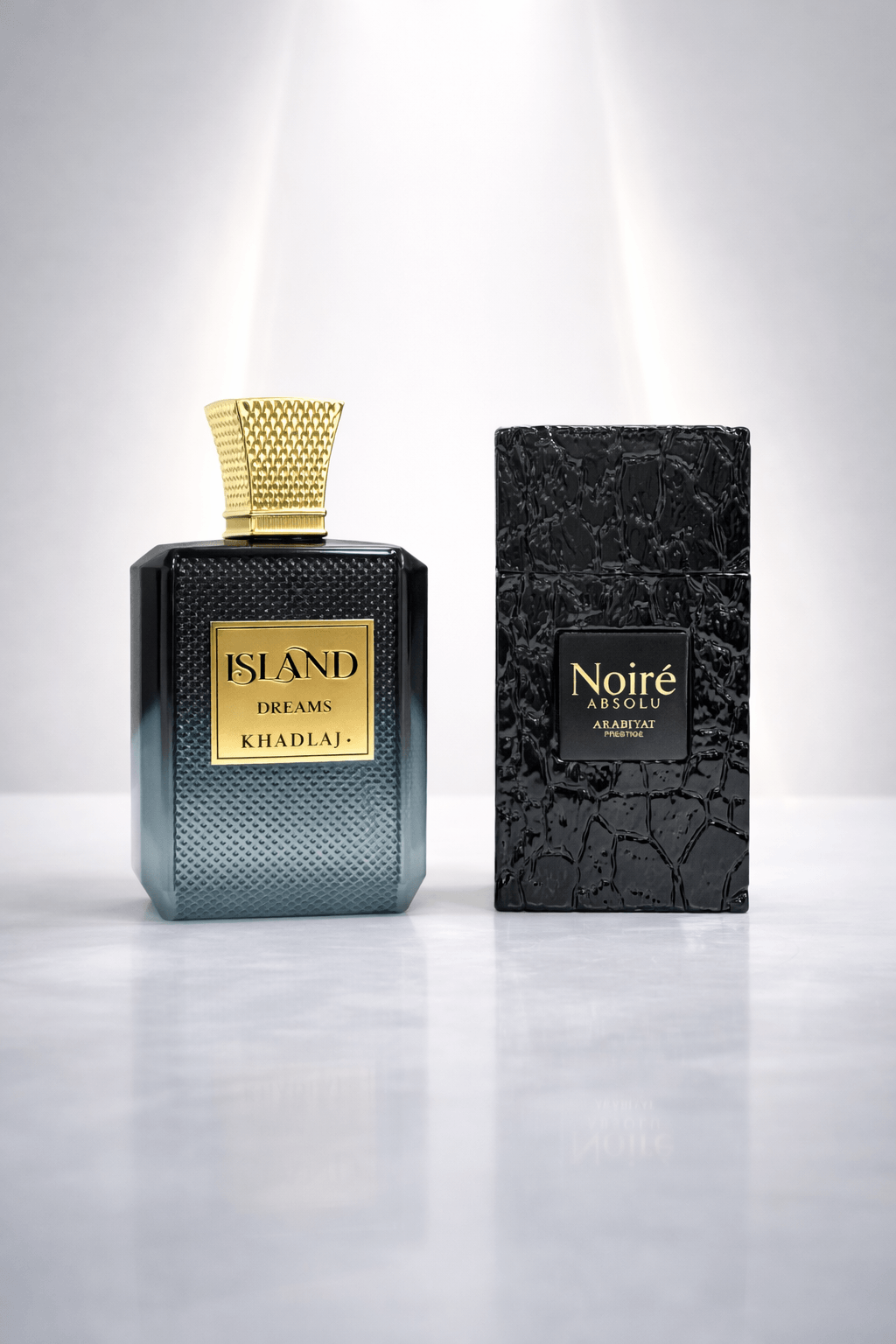 Luxury perfume bundle Island Dreams Khadlaj and Noire Absolu Arabiyat displayed on clean background