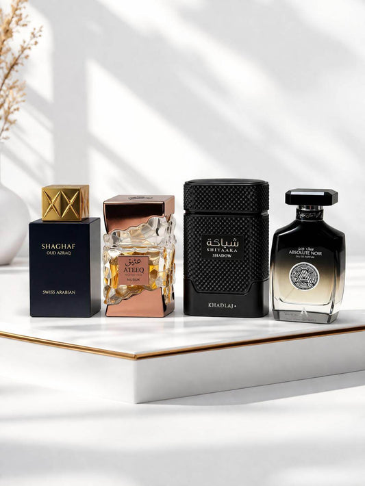 Luxury oud fragrance bundle with Shaghaf Oud Azraq, Ateeq, Shiyaaka Shadow and Absolute Noir perfumes on white background