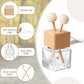 Refillable car vent diffuser — clear glass bottle with beech wood cap, rotating clip and wooden aroma sticks
