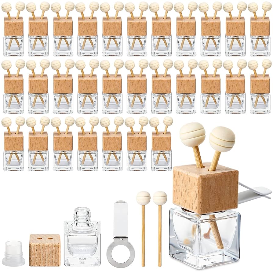 Refillable car vent diffuser — clear glass bottle with beech wood cap, rotating clip and wooden aroma sticks